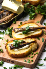 sandwiches with sprats and herbs