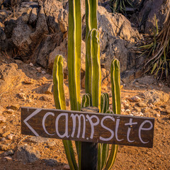 Wooden campsite sign in Kamanjab in Namibia.