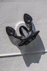 Anchors on the old riveted ship hull