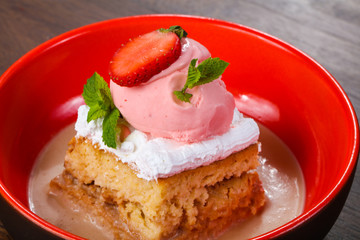 Cake with ice cream served stravberry