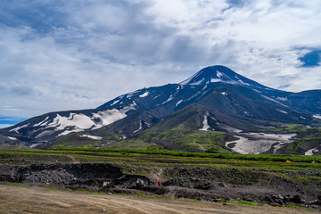 Naklejka premium Panoramic view of the city Petropavlovsk-Kamchatsky and volcanoes: Koryaksky Volcano, Avacha Volcano, Kozelsky Volcano. Russian Far East, Kamchatka Peninsula.