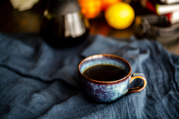 coffee cup and coffee pot on table