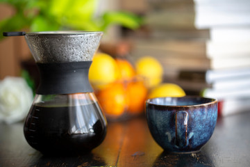 coffee cup and coffee pot on table