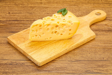 Maasdam cheese - yellow triangle with holes