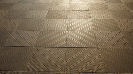 Obraz premium The brown tiled floor background