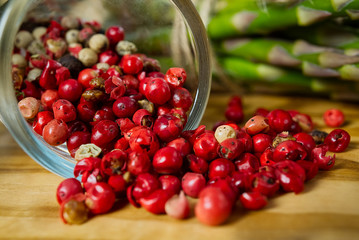 Red pepper peas with asparagus on wood board. Peas pepper. Red pepper close - up background