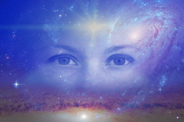 the eyes of a clairvoyant in space against the background of the starry sky and galaxies. The...