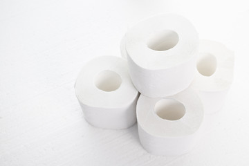 Shortage of toilet paper in stores during the epidemic and quarantine. Rolls of toilet paper on a white background