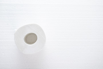 The main commodity during the coronavirus epidemic. Roll of toilet paper on a white background with copy space
