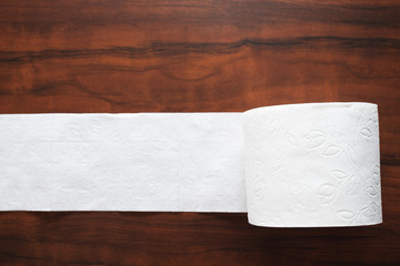 The main commodity during the coronavirus epidemic. Toilet roll on wooden background