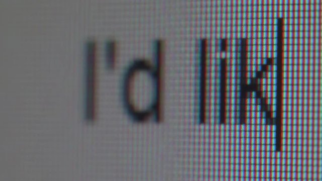 Typing letter in informal style. Close up view of screen and letters.