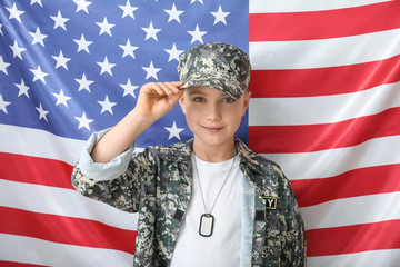 Cute little soldier against USA flag