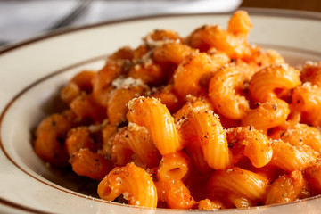 A view of a cellantani pasta dish, in a restaurant or kitchen setting.