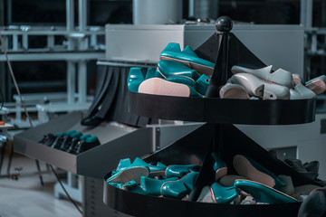 shelf with mold and insoles for shoe on modern factory