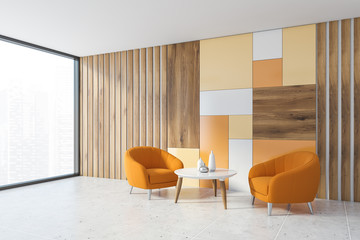 Wooden living room corner with orange armchairs