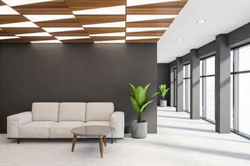 Gray office waiting room with white sofa