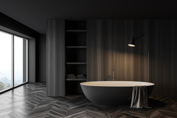 Obraz na płótnie Canvas Dark wooden bathroom interior with tub