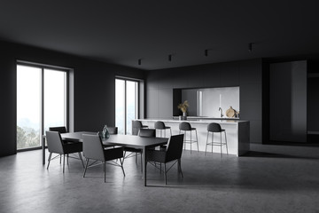 Gray and white kitchen corner with bar and table