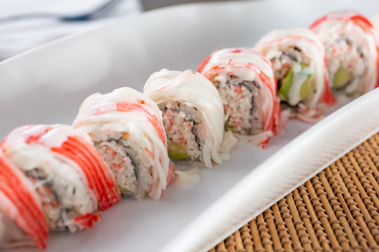 A View Of An Imitation Crab Meat Roll Plate, In A Restaurant Or Kitchen Setting.