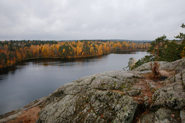 View from the top of the rock Parnassus over the lake yastrebinoe. Russia, Leningrad region, Karelian isthmus. Beautiful autumn landscape with a lake and a rock