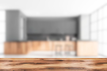 Table in blurry gray kitchen with bar