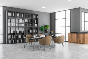 Gray and wood kitchen corner, table and bookcase © ImageFlow