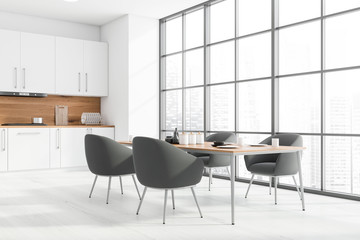 Panoramic white kitchen corner with table