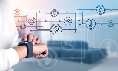 Woman using smartwatch with smart home icons