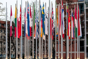 Munich/Germany - January 2020: National flags of different states on the flagpoles near European Patent Office in Munich