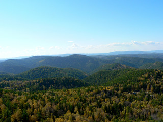 Mountains covered with forest in autumn