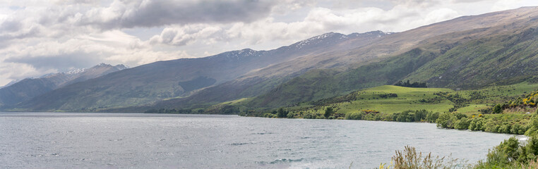 green shores of Wakatipu lake, near Kingston, New Zealand