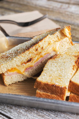A view of a tray of a monte cristo sandwich, in a restaurant or kitchen setting.
