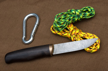 damascus knife. tourist equipment. EDC. Everyday carry. on tarpaulin.