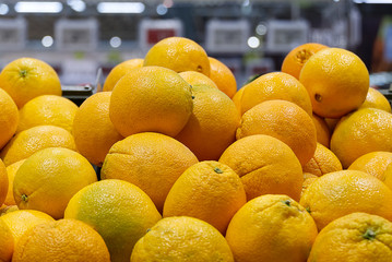 Texture of fresh tangerines and oranges on a store counter. Fresh Fruit Market Oranges Layout background
