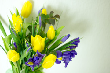 Bouquet of yellow and lilac irises close-up