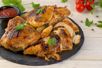 grilled chicken with barbecue sauce on a wooden background