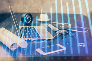 Stock market chart hologram drawn on personal computer background. Multi exposure. Concept of investment.