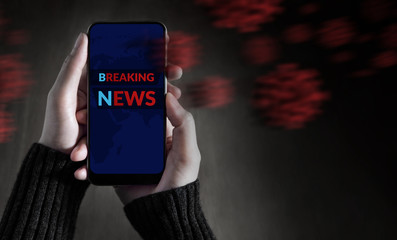 Covid-19 Situation Concept. Breaking News Headline Showing on Mobile’s Screen. Person Using a Smartphone to Checking News and Corona Virus Update. Top View
