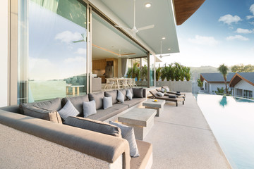 Interior and exterior design of pool villa, house and home feature sun bed and cushion by pool terrace