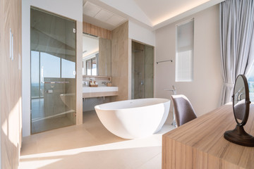 Fototapeta na wymiar Interior design of round bathtub in modern bathroom of pool villa, house, home, condo and apartment