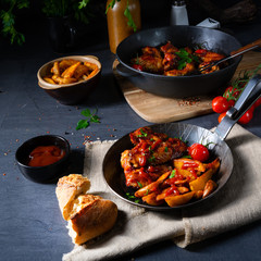 Rustic chicken wings in honey with potato wedges
