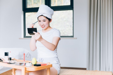 Asian young woman makeup at home