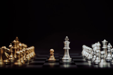 Business competition and strategy plan concept. Chess board game gold and silver colour