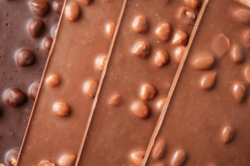 Sweet chocolate with nuts as background