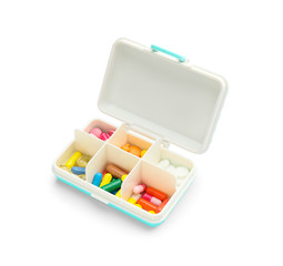 Container with pills on white background