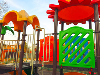 outdoor Playground made of bright plastic elements with slides and ladders