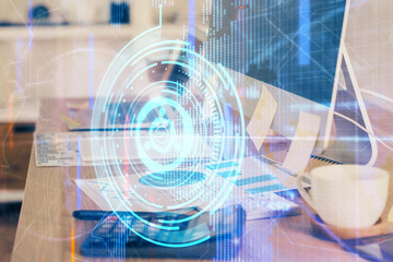 Double exposure of desktop computer and technology theme hologram. Concept of software development.