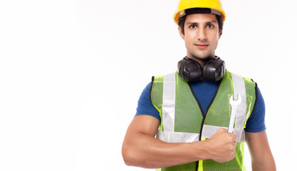Industrial engineer man hold wrench. Factory man worker wear hardhat, reflective vest. Handsome young industry engineer guy working in heavy industry manufacturing factory. He repair machine. isolated
