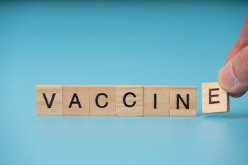 Vaccine infection concept. Letter  of  wooden blocks