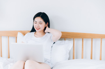 Asian young women use laptops at home